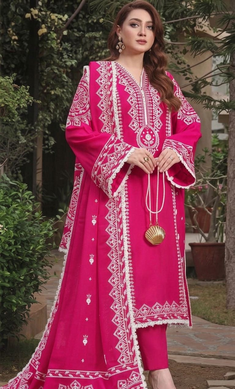 Model wearing a vibrant shocking pink Aneelas Dhanak 3pc suit with heavy white embroidery from the winter collection sale unstitched.