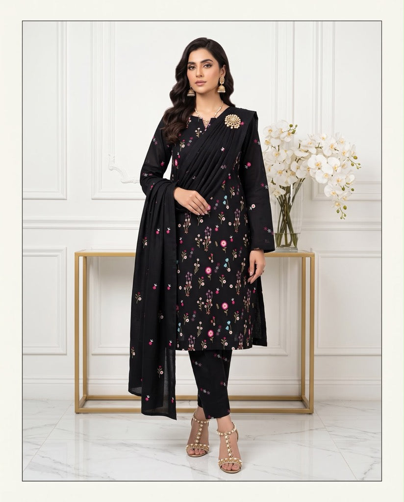 Model wearing a classic black premium Airjet Dhanak unstitched suit with vibrant floral embroidery from Aneela's Winter Collection.