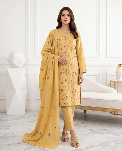 Mustard yellow premium Airjet Dhanak unstitched suit with vibrant floral embroidery from Aneela's Winter Collection, worn by a model.