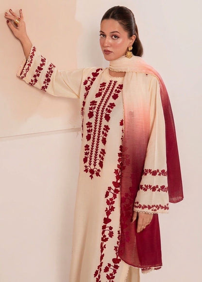 Close-up of rich red floral embroidery on the premium cream Airjet Dhanak winter fabric.