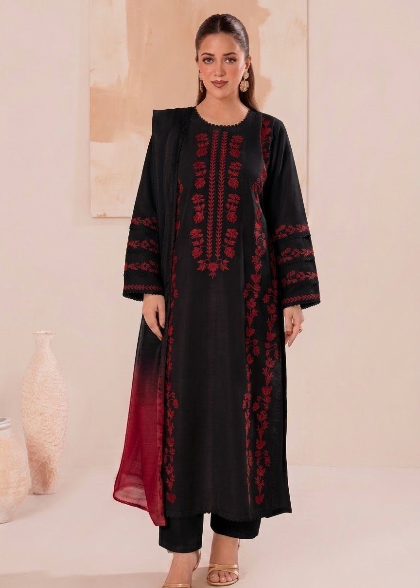 Model wearing a black Laam Dhanak 3pc suit with red heavy embroidery from the Laam sale winter collection.